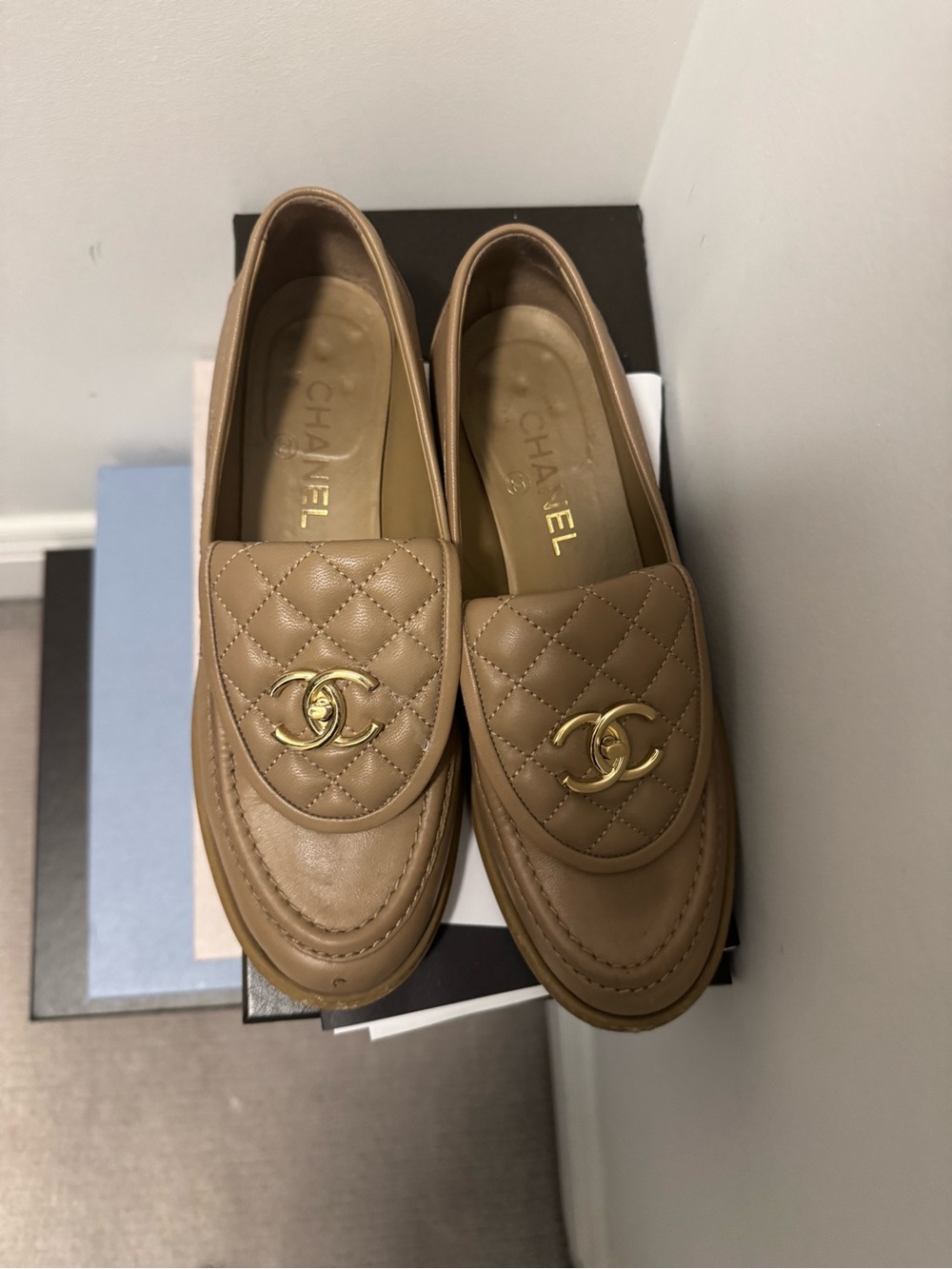 CHANEL Quilted Leather CC Logo Loafers in Tan